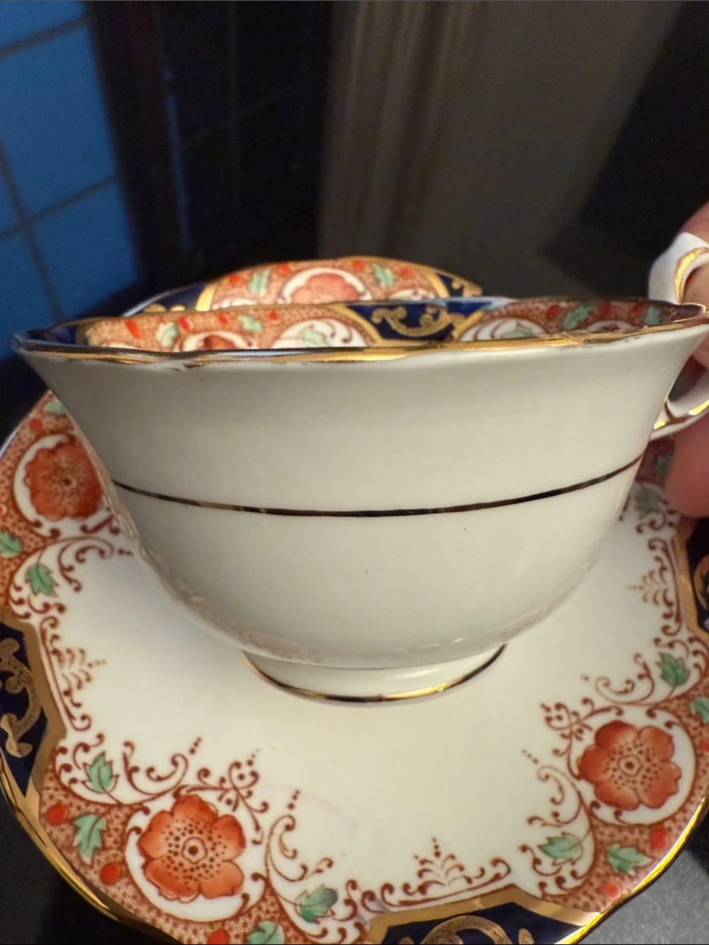 Decorative White and Navy Porcelain Tea Cup with Gold Accents
